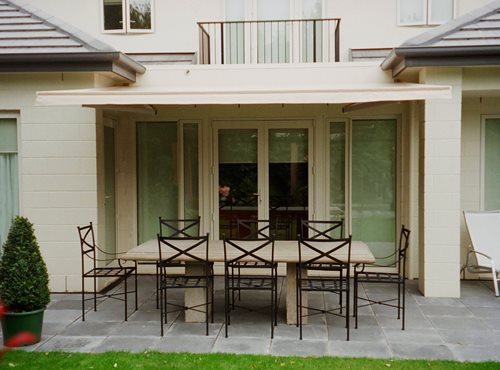 Euro Retractable awning open over outside dining table