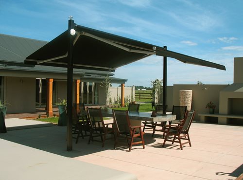 Plaza canopy open providing shade for the outdoor dining table