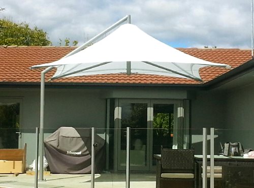 Parasol Umbrella shading porch barbecue and dining table