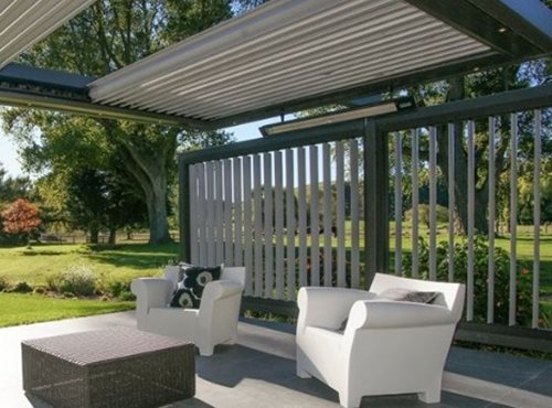 Outdoor heaters hanging over sitting area outside house